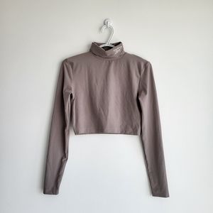 REEBOK Nude Embroidered Logo Cropped Long Sleeve Turtleneck